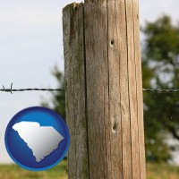 south-carolina map icon and a fence, constructed of wooden posts and barbed wire