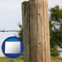 wy map icon and a fence, constructed of wooden posts and barbed wire