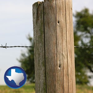 a fence, constructed of wooden posts and barbed wire - with Texas icon