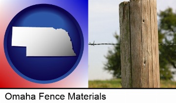 a fence, constructed of wooden posts and barbed wire in Omaha, NE