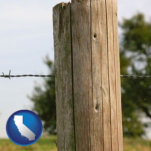 a fence, constructed of wooden posts and barbed wire - with California icon