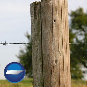 a fence, constructed of wooden posts and barbed wire - with Tennessee icon